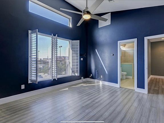 Master bedroom looking into the en-suite bathroom. There is a shower and a tub.