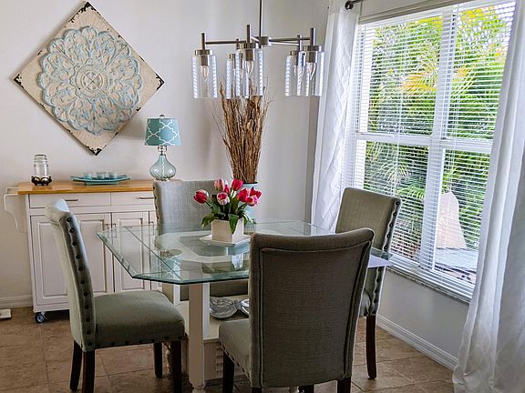Glass dining table + rolling side board
Window has view of lake