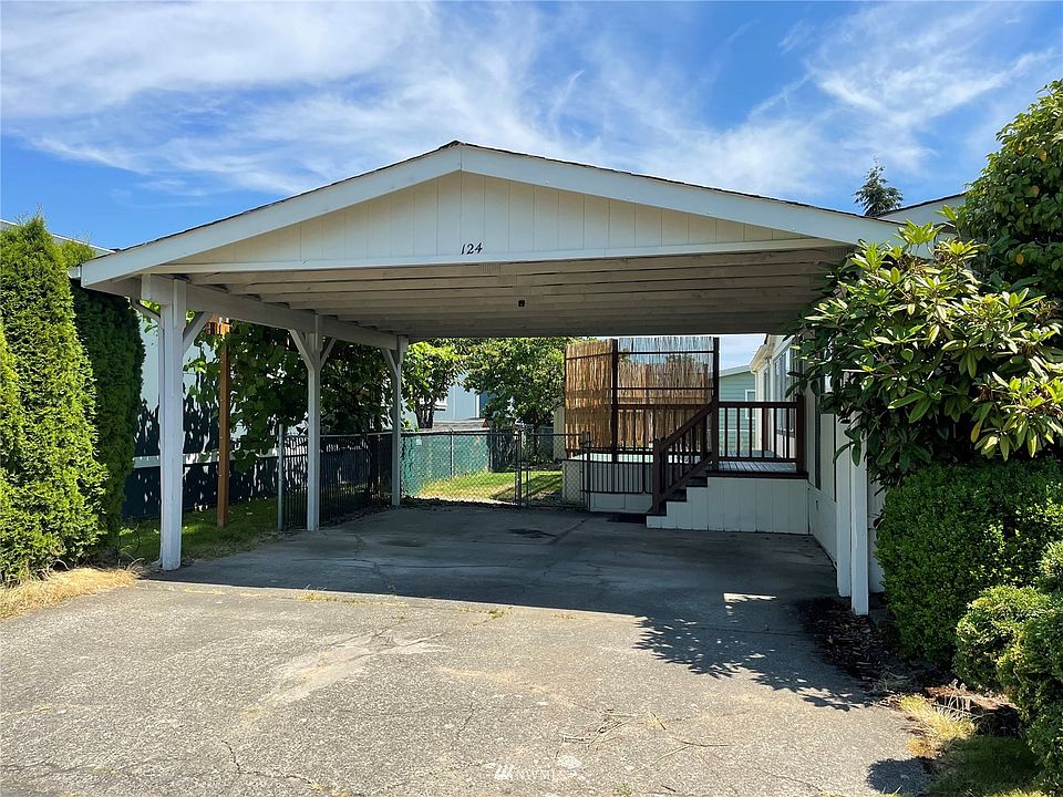 Covered 2 car garage with gated access to back yard