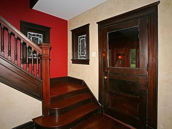Staircase with original stained glass windows from 1800's