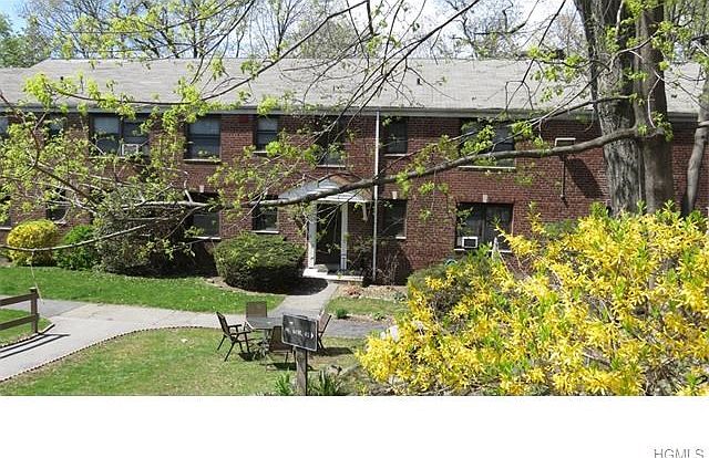 Bright and spacious apartment nestled in a serene courtyard setting.