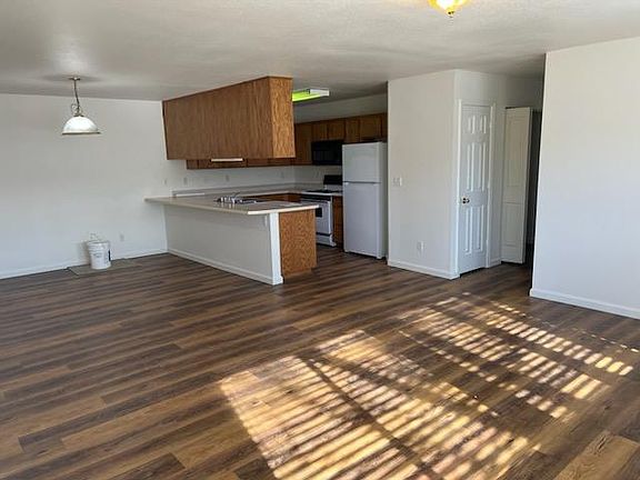 Kitchen, dining, and living rooms.