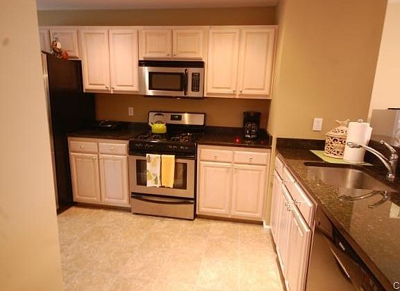 Updated kitchen with granite counters and stainless steel applia