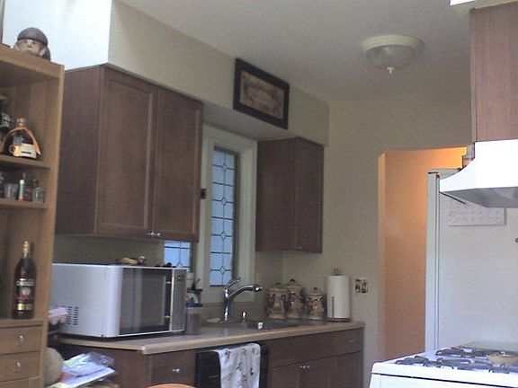 New Kitchen - Maple cabinetry w/brushed nickel hardware 2/09, tile flooring