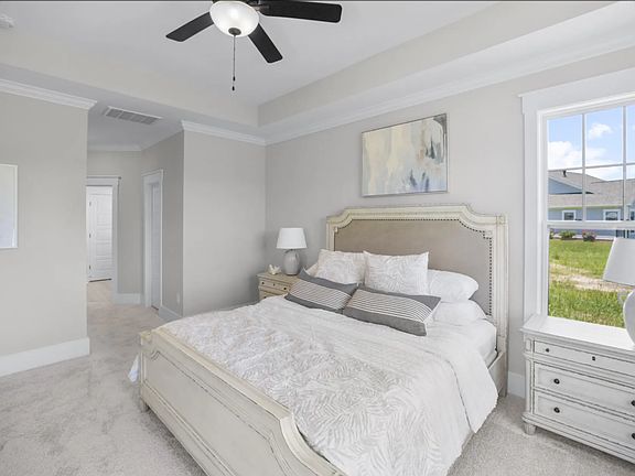 Primary suite. We do NOT have the window next to the bed. Have a large window that overlooks the backyard pond.