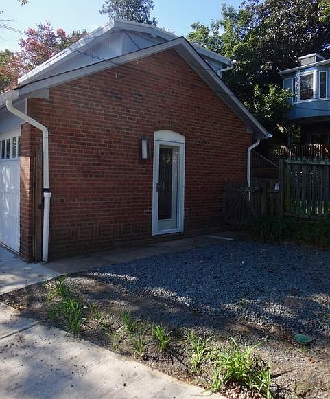 Exterior - entry door (patio now enclosed with a fence along the alley)