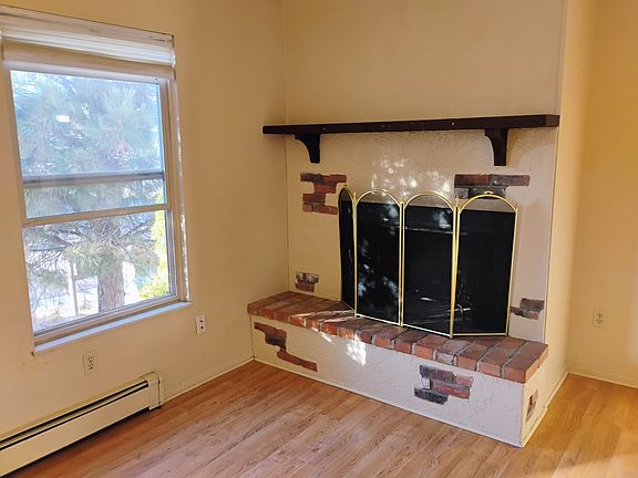 woodburning fireplace in living room