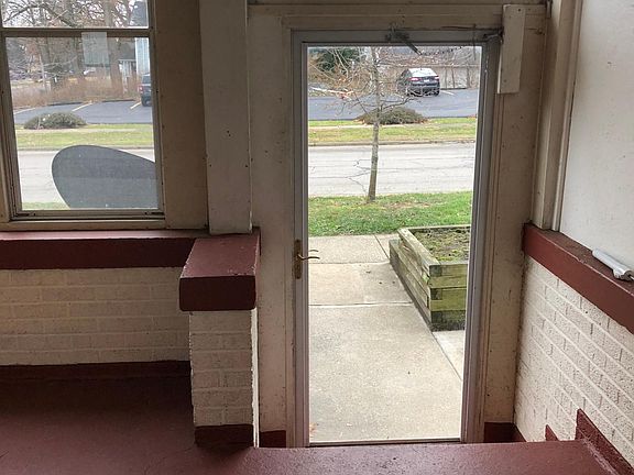 Front door looking at Falls Ave from enclosed porch.