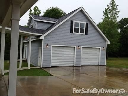 Garage
						:
						There is a separate three car garage with a potential apartment above.