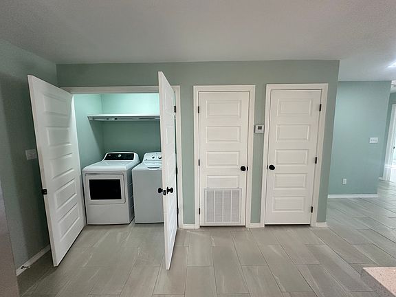 Laundry room with washer and dryer included