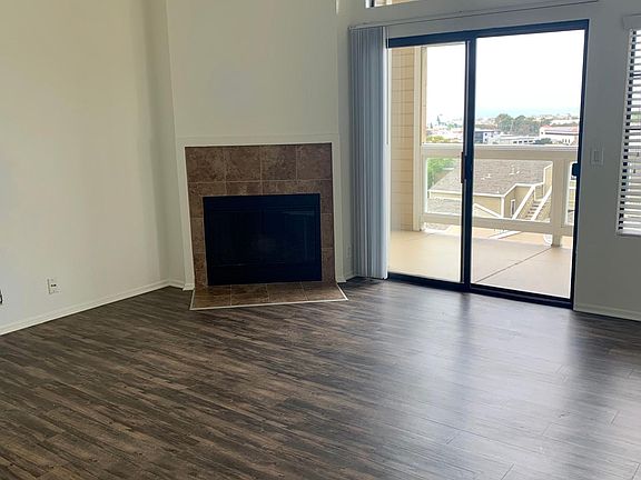 High Vaulted Ceiling in Living Room with Wood Burning Fireplace