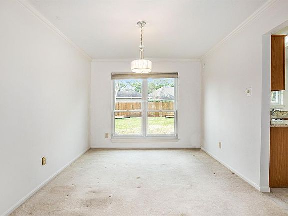 A formal dining room with views of the backyard making this space so inviting! Direct access to the kitchen is even more convenient!