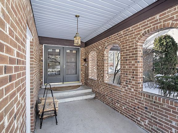 Covered front entry adjoins attached garage