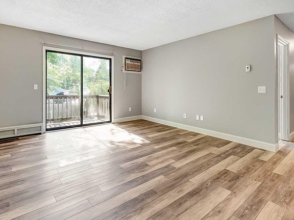 large living room, 5+ inch floor trim, new luxury plank floo