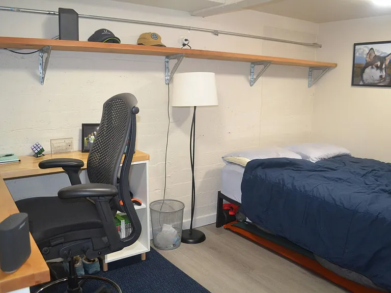 the studio has a separate 'nook' for a bedroom with a division between the sleeping and living areas.