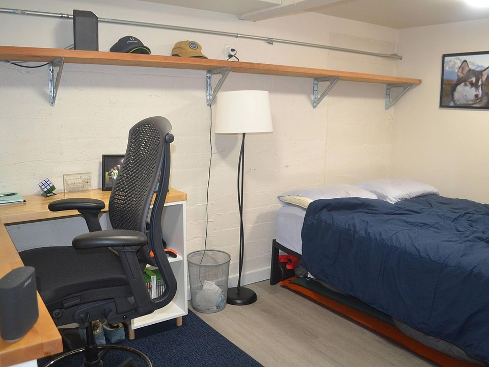 the studio has a separate 'nook' for a bedroom with a division between the sleeping and living areas.