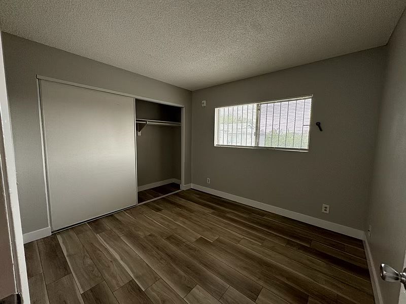 Second bedroom with new flooring and new paint.