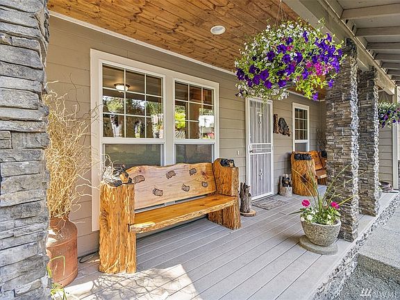 You may sit on the wide porch to greet your neighbors.