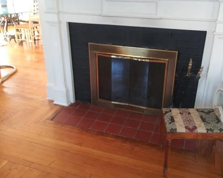 Working fireplace in living room is brass
