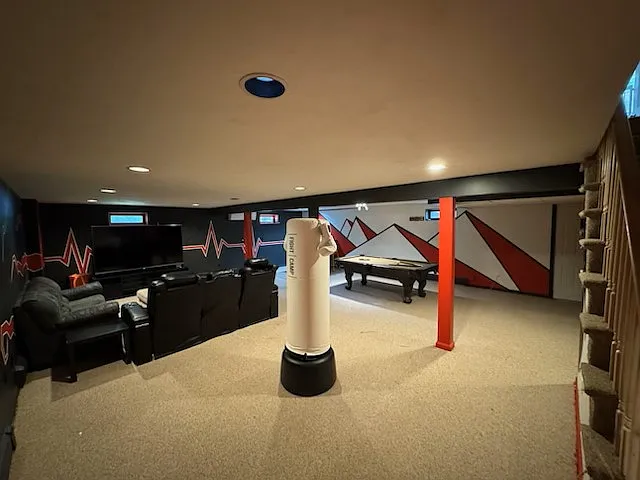 entertainment center with big-screen TV, pool table and bar