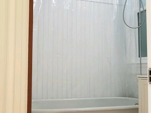 Tub with overhead shower