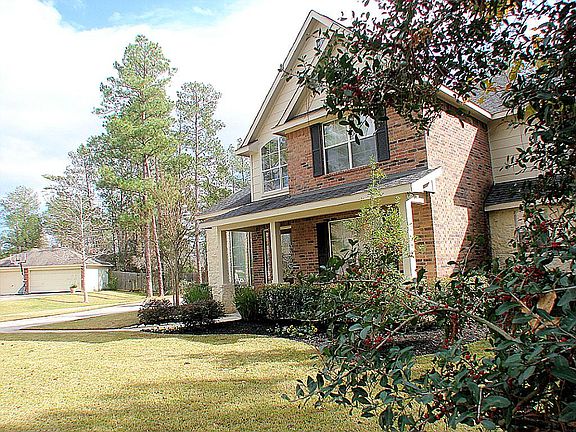 Mature trees surround this home.