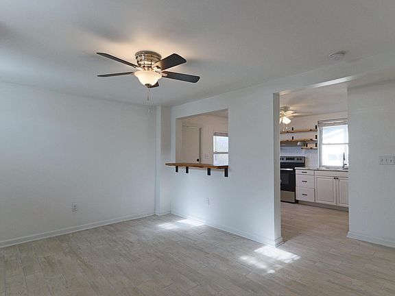 Open concept living room facing front door