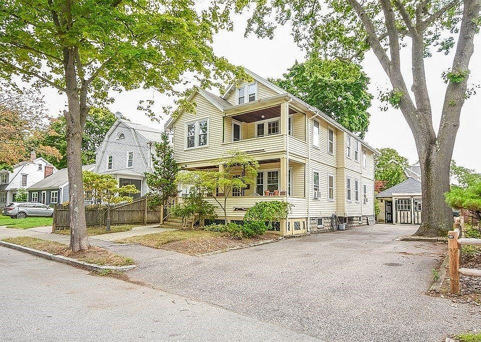 House; Parking is in-front of tree.