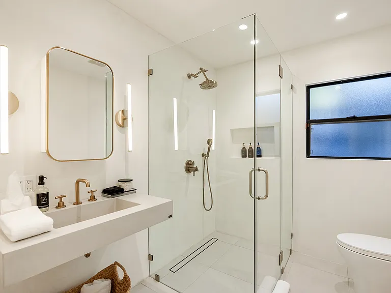 Golden accents and polished fixtures bring luxury to every moment.
