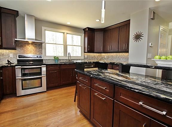 Designer cabinets, custom tile backs splash and stainless steel appliances highlight this chef's dream kitchen.