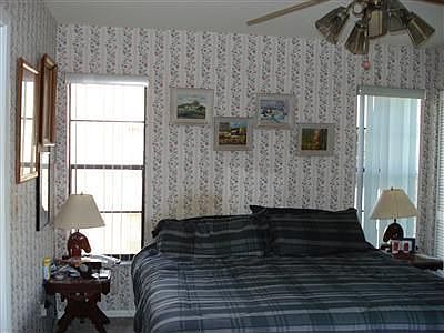Master bedroom with 2 walk-in closets and sliders to lanai