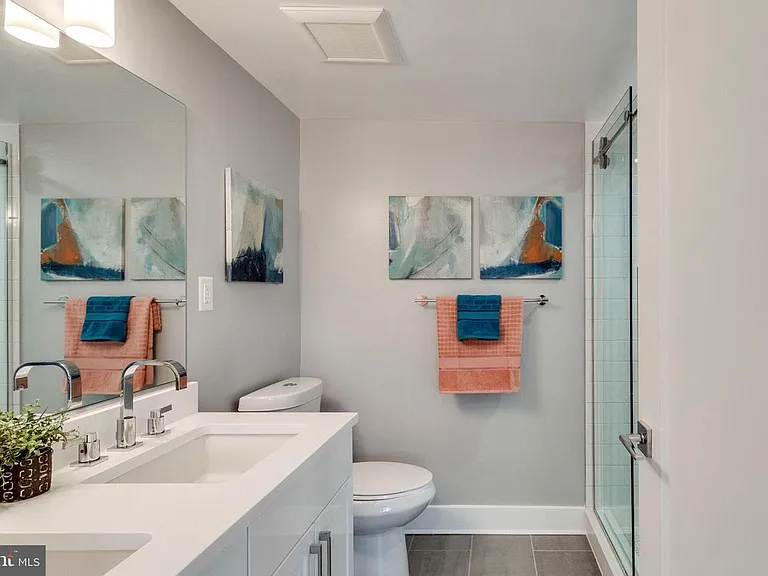Full bathroom with double vanity and modern fixtures