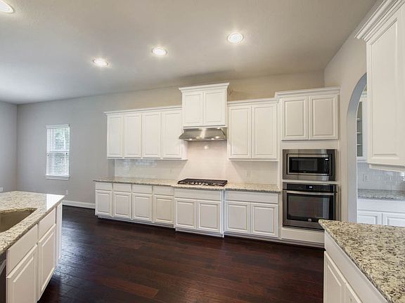 Pristine white granite countertops and back splash.