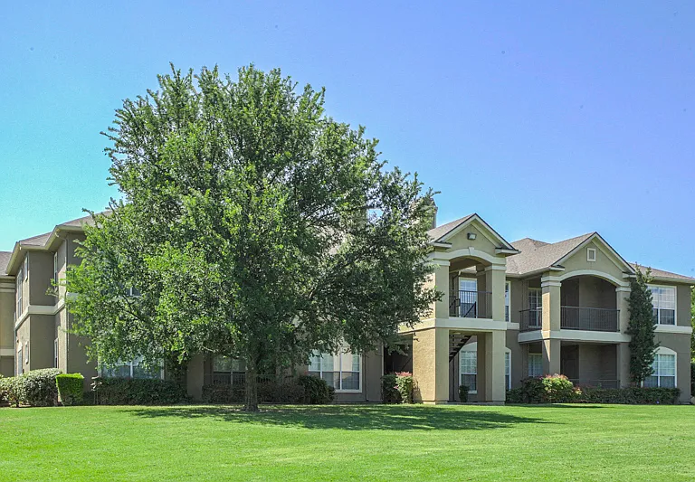 Landscaped Grounds with mature trees and seasonal color change