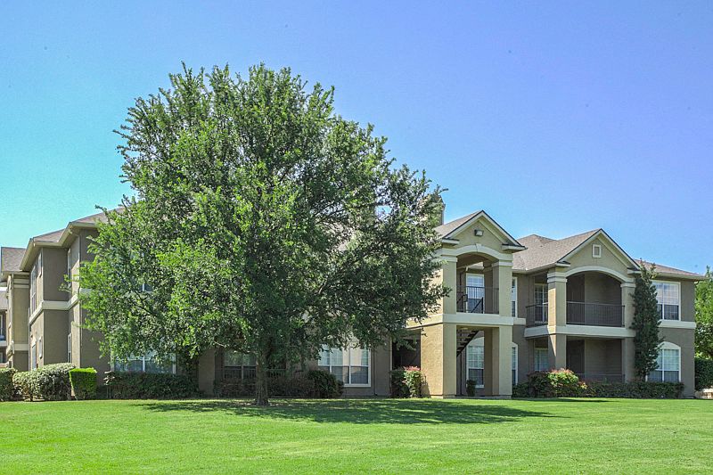 Landscaped Grounds with mature trees and seasonal color change