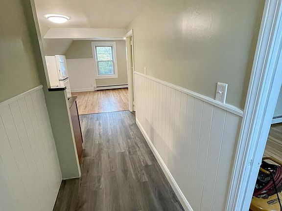 Entry leading from stairs. Bedroom is on your right, stairs leading down to the front door on your left