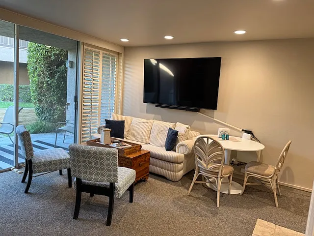 Seating area with patio to left.