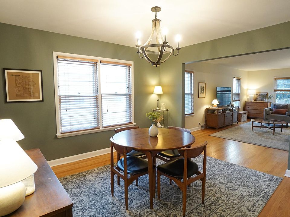 Stunning dining room flows into inviting living room.