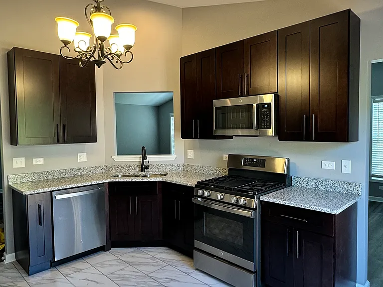 Kitchen with breakfast nook & pantry. Stainless steel appliances