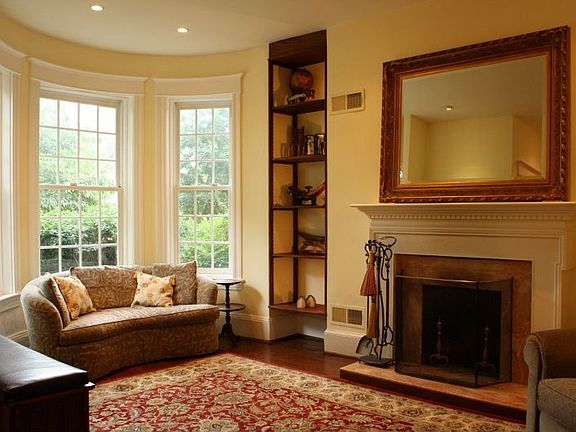 Living room with custon builtins and fire place 