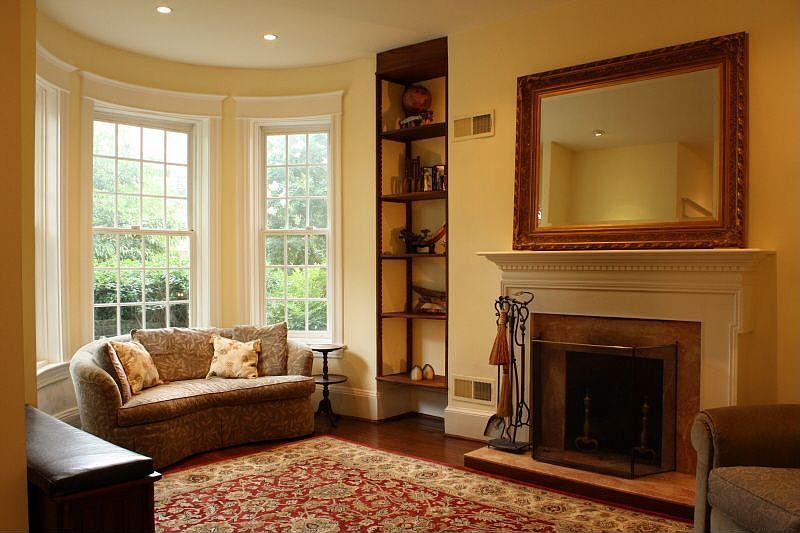 Living room with custon builtins and fire place 