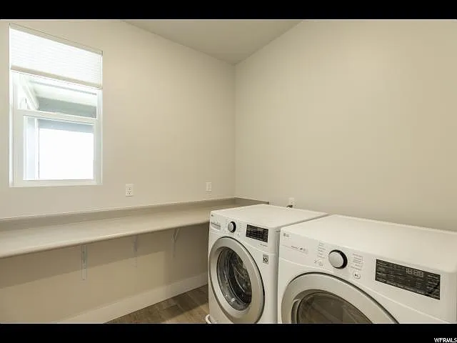 Laundry room large enough to store your boots and essentials just off the garage entryway.