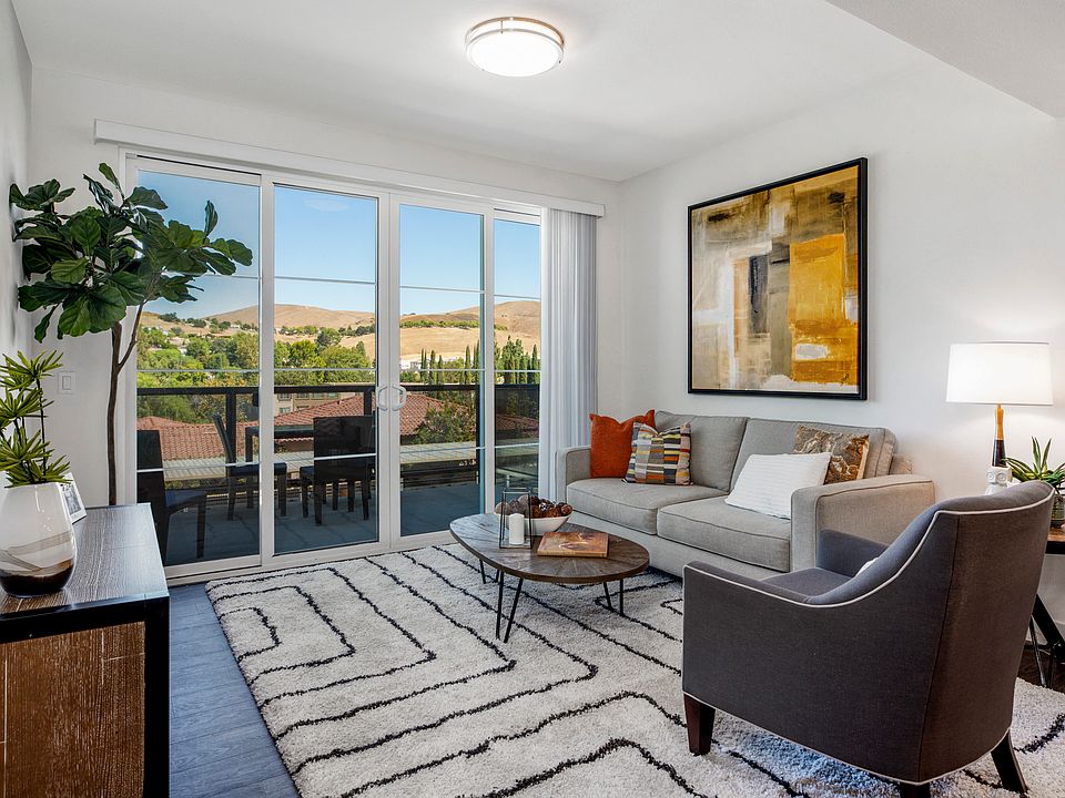 YOLO East furnished living area and patio