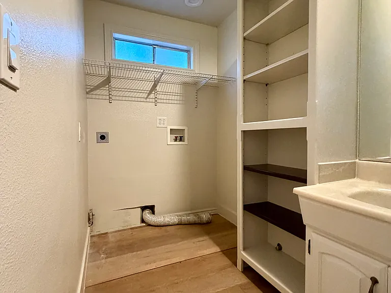 Downstairs bathroom with laundry facility