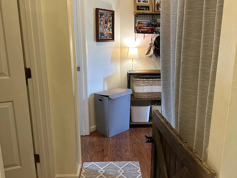 Washer and Dryer on right behind curtain.