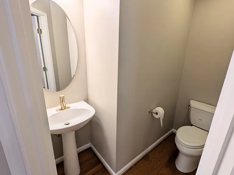 half bathroom, adjacent to office and kitchen