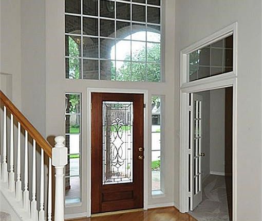 Flooded with natural light & gleaming hardwoods, this welcoming entry will leave lasting impressions.