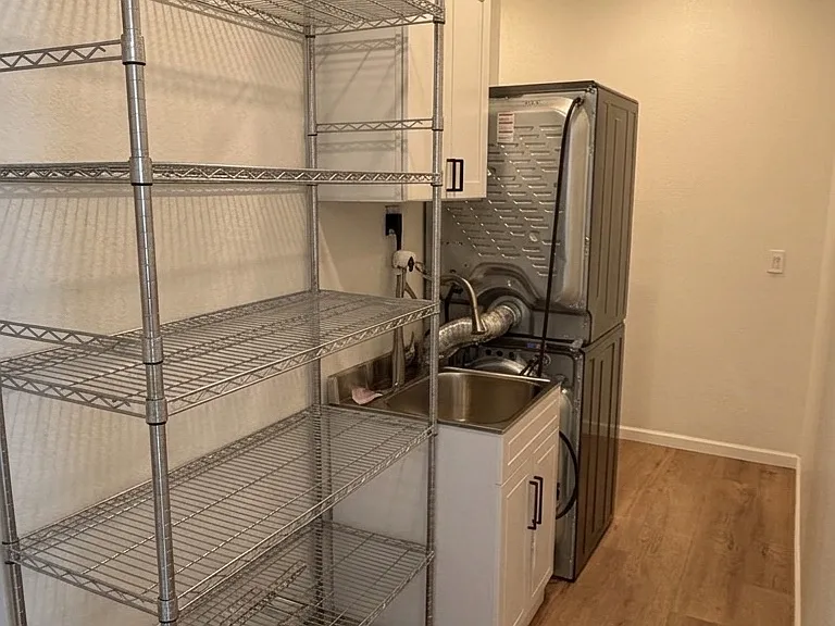 main floor hallway / laundry / pantry (huge restaurant shelves and laundry sink)