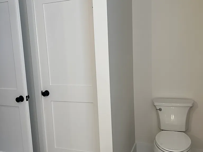 Master bedroom bathroom closet storage and toilet