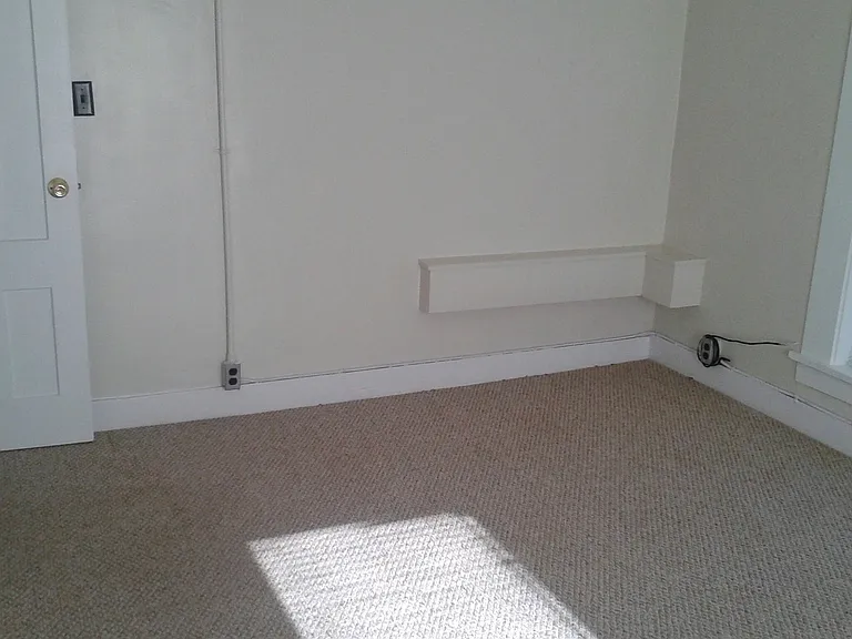 Main bedroom. (Box in corner is for water pipes.) Bathroom is on the other side of the wall.